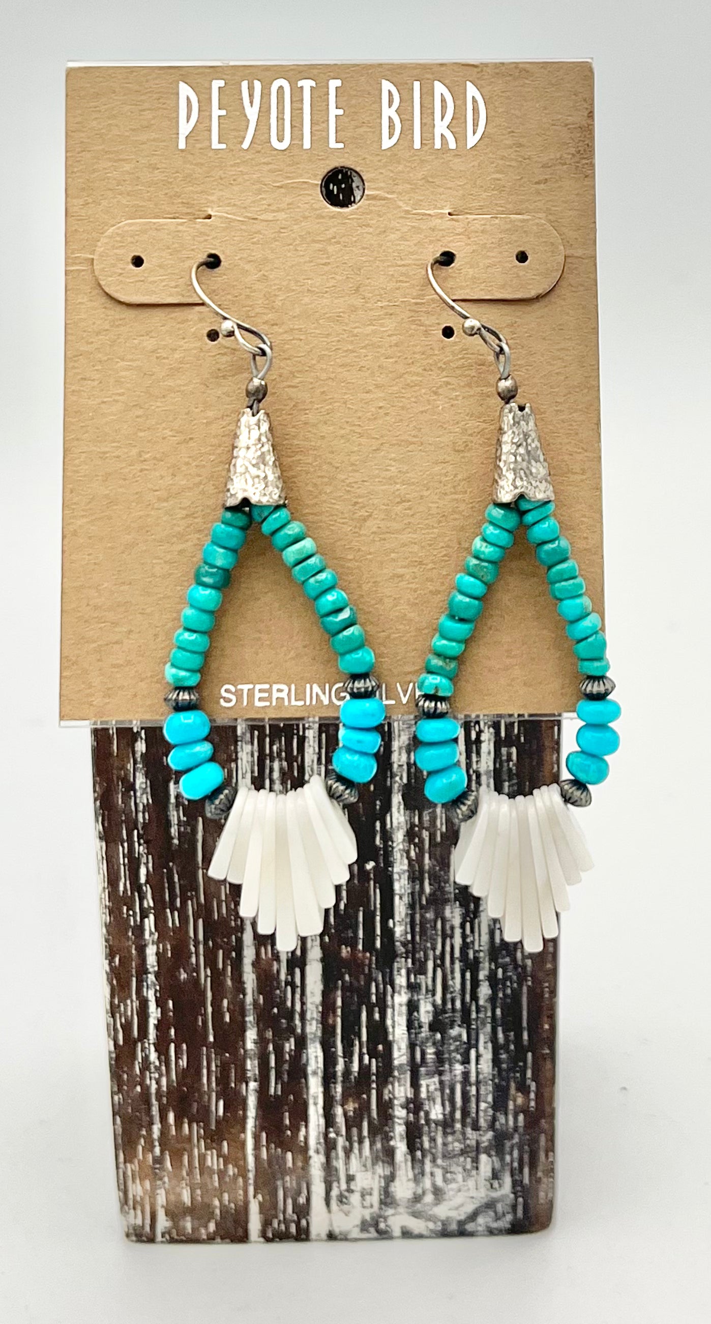 Turquoise beaded teardrop earrings with shell detail
